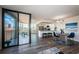 Bright open concept living space with a kitchen, dining area, and balcony access at 6158 Palma Del Mar S Blvd # 306, St Petersburg, FL 33715