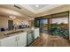 Open living space featuring a kitchen, dining, and seating area with access to a balcony at 6158 Palma Del Mar S Blvd # 306, St Petersburg, FL 33715