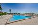 Community pool showcasing waterfront views, lounge seating and easy access stairs at 6158 Palma Del Mar S Blvd # 306, St Petersburg, FL 33715