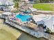 Aerial view of a community pool and clubhouse, perfect for relaxation and social gatherings at 6158 Palma Del Mar S Blvd # 306, St Petersburg, FL 33715