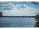 Expansive water view showing houses along the coastline and blue skies at 6158 Palma Del Mar S Blvd # 306, St Petersburg, FL 33715