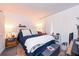 Cozy bedroom with a comfortable bed and a window, complemented by wood-look floors and soft lighting at 618 Bird Bay S Dr # 111, Venice, FL 34285