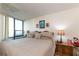 Comfortable main bedroom filled with natural light, featuring a king-size bed and tasteful decor at 618 Bird Bay S Dr # 111, Venice, FL 34285