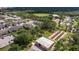 Wide aerial view of a residential community with amenities, including a community garden and sports fields at 6542 95Th N Pl, Pinellas Park, FL 33782