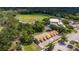 This aerial view showcases a baseball field, sport courts, and recreational facilities in the residential community at 6542 95Th N Pl, Pinellas Park, FL 33782