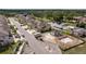 Aerial shot of townhouses next to a partially finished pool with nearby parking and landscaping at 6542 95Th N Pl, Pinellas Park, FL 33782