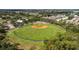 Overhead view of a baseball field within a lush, green park, surrounded by trees at 6542 95Th N Pl, Pinellas Park, FL 33782