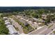 High angle view reveals the townhouse community with a pond and ample parking at 6542 95Th N Pl, Pinellas Park, FL 33782