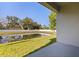 Scenic backyard view with pond, offering a serene and peaceful outdoor experience at 6542 95Th N Pl, Pinellas Park, FL 33782