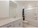 Bright bathroom featuring vanity with a sleek countertop and a shower-tub combination at 6542 95Th N Pl, Pinellas Park, FL 33782