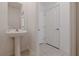 Half bathroom features a pedestal sink and tiled flooring at 6542 95Th N Pl, Pinellas Park, FL 33782