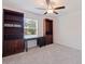 Bedroom with dual bookcases and a view of the yard, ideal for a home office at 6542 95Th N Pl, Pinellas Park, FL 33782