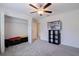 Bedroom has a ceiling fan, closet, and space for storage, ideal for organization at 6542 95Th N Pl, Pinellas Park, FL 33782