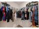 Spacious walk-in closet featuring ample hanging space and a variety of storage options at 6542 95Th N Pl, Pinellas Park, FL 33782