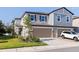 Charming two-story townhome featuring a two-car garage, stone accents, and well-maintained landscaping at 6542 95Th N Pl, Pinellas Park, FL 33782