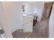 Carpeted staircase with white walls and handrail leading to the upper level at 6542 95Th N Pl, Pinellas Park, FL 33782