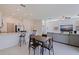 Spacious open-concept living area with bar seating, dining space, and natural light at 6542 95Th N Pl, Pinellas Park, FL 33782