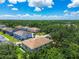 Scenic view of residential neighborhood featuring well-maintained homes surrounded by mature trees and greenery at 6745 Citrus Creek Ln, Tampa, FL 33625