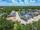 Overview of attractive neighborhood highlighting community pond, lush landscaping, and various home styles in a friendly environment at 6745 Citrus Creek Ln, Tampa, FL 33625
