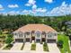 Aerial shot shows the layout and design of the townhouse property and the surrounding neighborhood at 6745 Citrus Creek Ln, Tampa, FL 33625