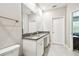 This bathroom boasts double sinks, a large mirror, and ample counter space at 6745 Citrus Creek Ln, Tampa, FL 33625