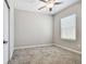 Cozy bedroom with a ceiling fan and natural light, ready for personalization at 6745 Citrus Creek Ln, Tampa, FL 33625