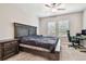 Bedroom showcasing a large bed, windows, and a desk area, perfect for relaxing and productivity at 6745 Citrus Creek Ln, Tampa, FL 33625