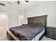 Comfortable bedroom featuring a large bed with nightstands and access to an ensuite bathroom at 6745 Citrus Creek Ln, Tampa, FL 33625