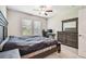 This bedroom includes a spacious bed, dresser with mirror, and a dedicated desk space at 6745 Citrus Creek Ln, Tampa, FL 33625