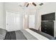 This bedroom features a bed, a dresser, and a closet with bi-fold doors at 6745 Citrus Creek Ln, Tampa, FL 33625