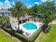 Stunning community pool area with lounge chairs, shaded seating, and a well-maintained pool surrounded by lush greenery at 6745 Citrus Creek Ln, Tampa, FL 33625