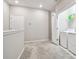 This is a hallway featuring neutral walls and access to laundry room at 6745 Citrus Creek Ln, Tampa, FL 33625