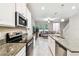 Kitchen with granite countertops and stainless steel appliances at 6745 Citrus Creek Ln, Tampa, FL 33625