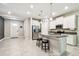 Stylish kitchen with white cabinets, granite countertops, and stainless steel appliances at 6745 Citrus Creek Ln, Tampa, FL 33625