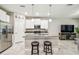 Well-equipped kitchen with an island, granite countertops and stainless steel appliances at 6745 Citrus Creek Ln, Tampa, FL 33625