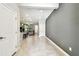 Open concept living space with tile floors and a view into the kitchen at 6745 Citrus Creek Ln, Tampa, FL 33625