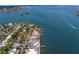 Stunning aerial view of a coastal neighborhood with waterfront homes and boat docks along the serene bay at 7060 S Shore S Dr, South Pasadena, FL 33707
