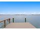 Scenic waterfront view from private dock with calm, clear waters and distant cityscape at 7060 S Shore S Dr, South Pasadena, FL 33707