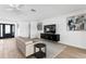 Bright living room with tile floors, modern furnishings, and stylish decor at 7060 S Shore S Dr, South Pasadena, FL 33707