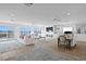 Spacious living area with waterfront views, fireplace, and dining area provides an elegant open-concept design at 7060 S Shore S Dr, South Pasadena, FL 33707