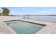 Stunning in-ground pool with beautiful waterfront views for a relaxing experience at 7060 S Shore S Dr, South Pasadena, FL 33707