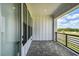 Patio overlooking water view, with brick floor and white siding at 7240 Sutton Ln, Sarasota, FL 34240