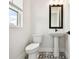 Charming bathroom features decorative tile flooring and a pedestal sink at 7240 Sutton Ln, Sarasota, FL 34240