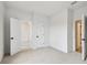 Bright, carpeted bedroom with ensuite bathroom and walk-in closet at 7240 Sutton Ln, Sarasota, FL 34240