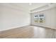 Bedroom boasts natural light and neutral flooring, creating a serene atmosphere at 7240 Sutton Ln, Sarasota, FL 34240