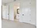 Carpeted bedroom with ensuite bathroom and closet at 7240 Sutton Ln, Sarasota, FL 34240