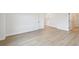 Spacious room features neutral walls and flooring, offering a versatile space at 7240 Sutton Ln, Sarasota, FL 34240