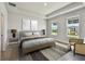 Serene bedroom with neutral tones, featuring a cozy bed, side tables with lamps, and natural light at 7240 Sutton Ln, Sarasota, FL 34240