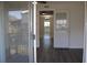 Open living area with sliding glass doors to the balcony at 7927 Kosi Palm Pl # 201, Tampa, FL 33615