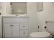Bright bathroom features a white vanity with storage and a well-lit mirror at 7927 Kosi Palm Pl # 201, Tampa, FL 33615